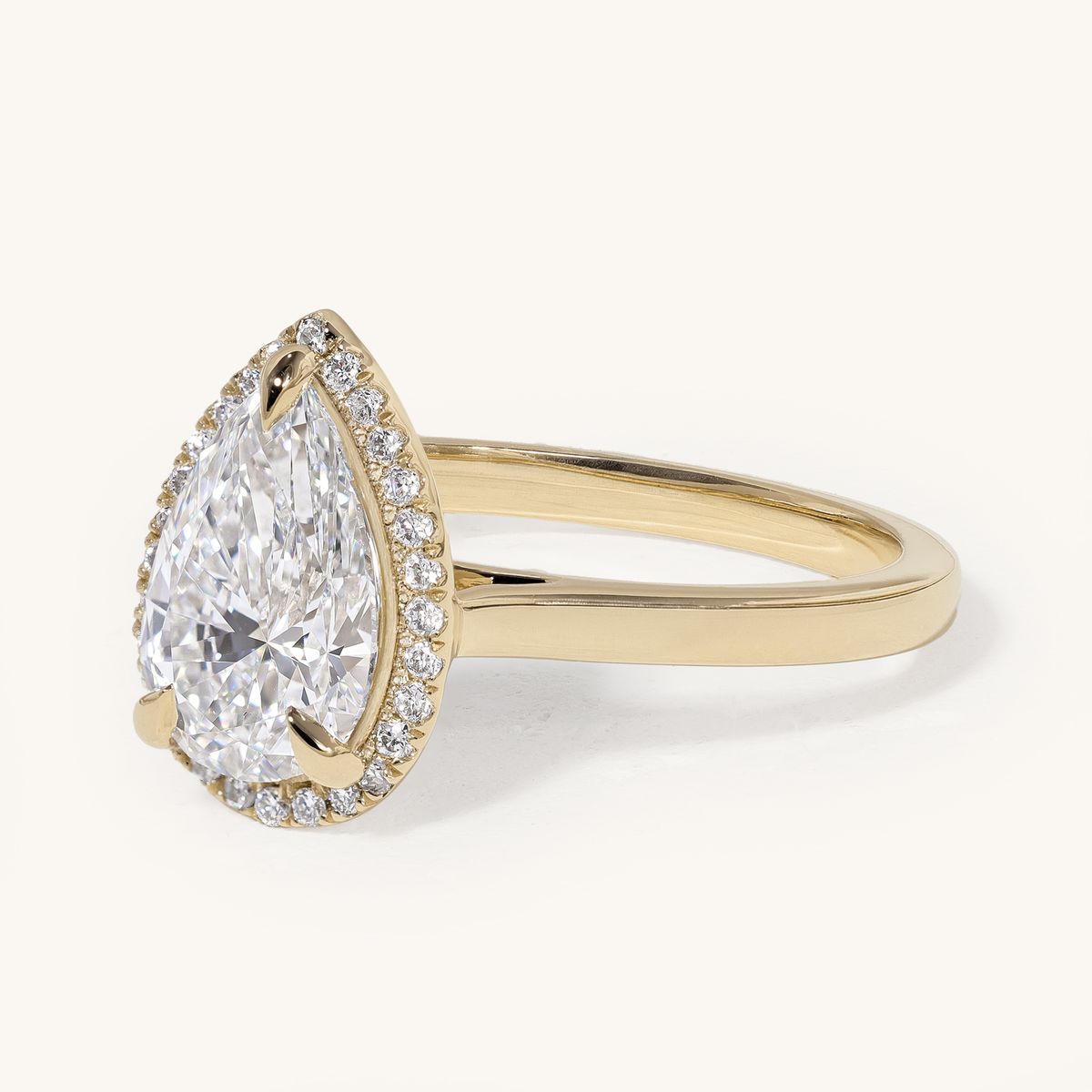 aideen_pear_claw_solitaire_halo_cathedral_engagement_ring_02