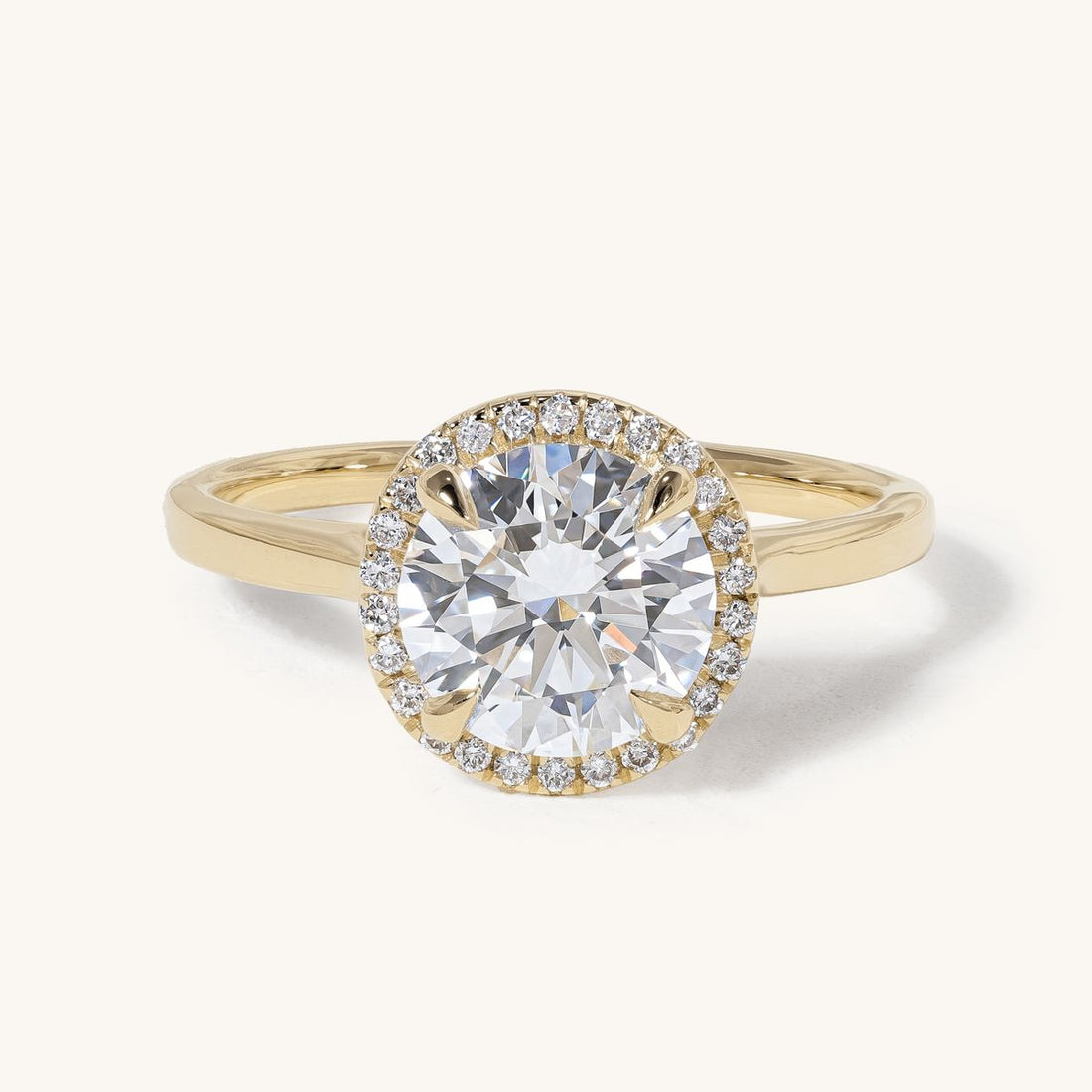 aideen_round_claw_solitaire_halo_cathedral_engagement_ring_01
