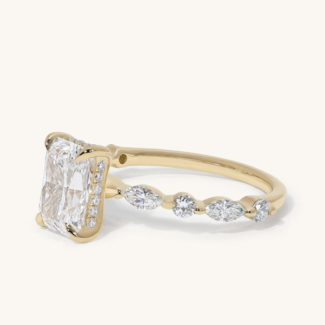 chelie_radiant_hidden_halo_marquise_accent_engagement_ring_01