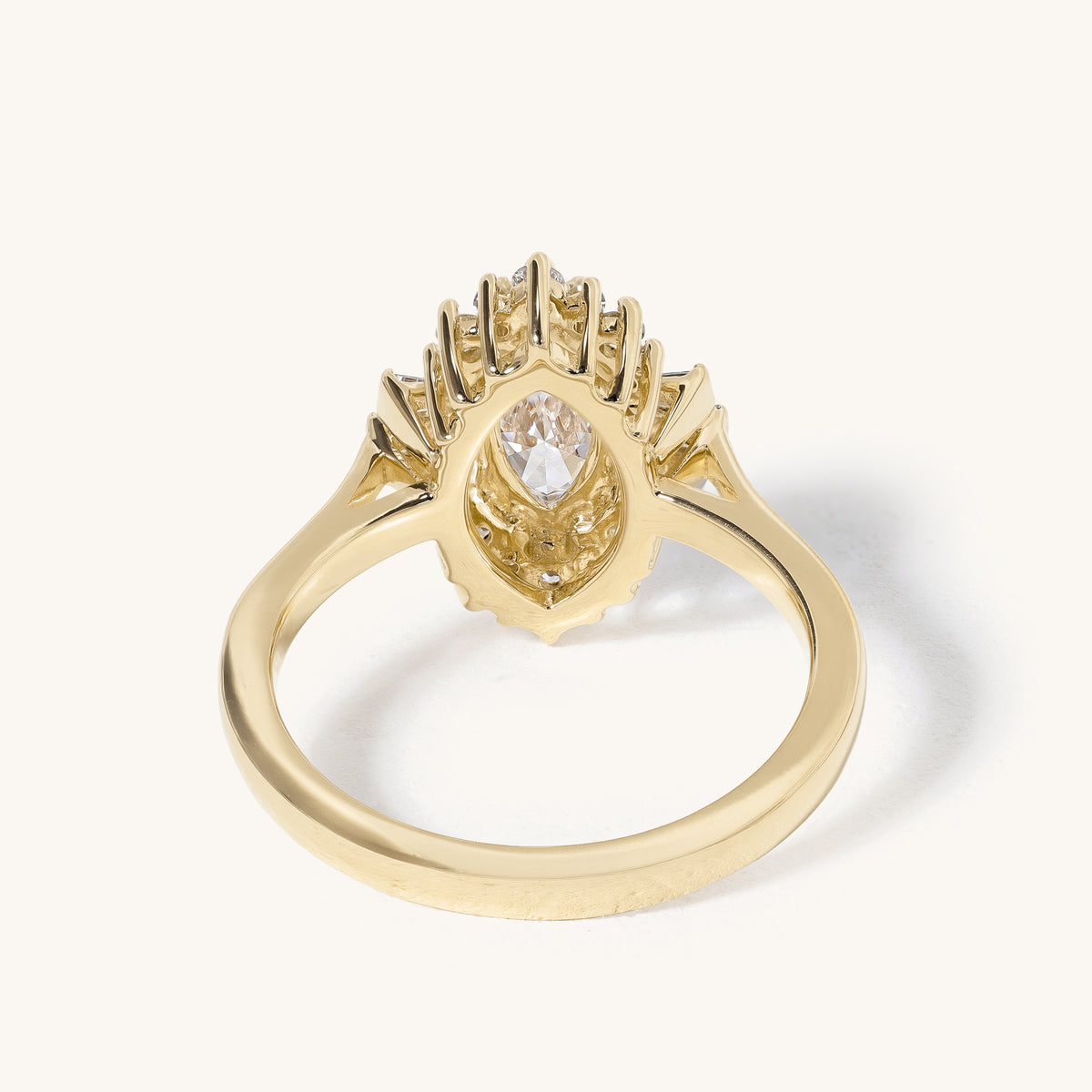 1ct Marquise Claw Solitaire with Tapered Baguette Fan Accents and Round Cluster Halo Engagement Ring