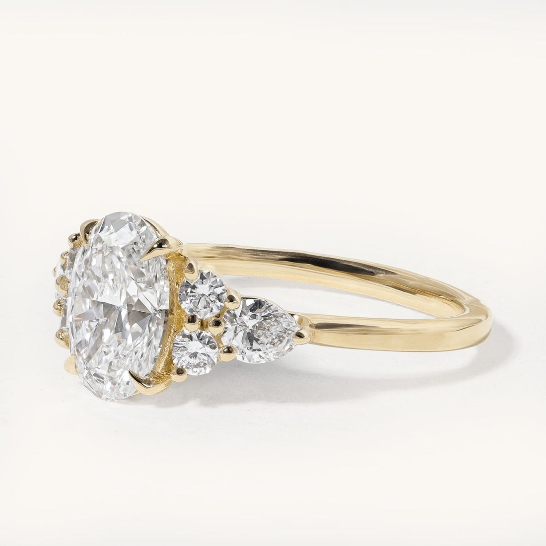 hendrix_oval_cathedral_cluster_shoulders_engagement_ring_01