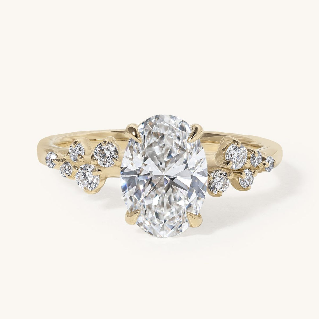 jacira_oval_solitaire_clustered_shoulders_engagement_ring_01