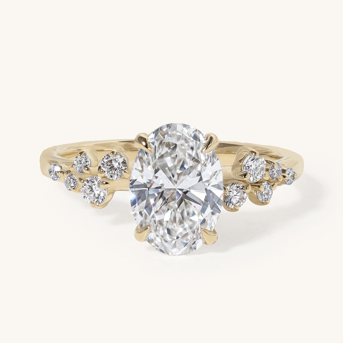 jacira_oval_solitaire_clustered_shoulders_engagement_ring_01
