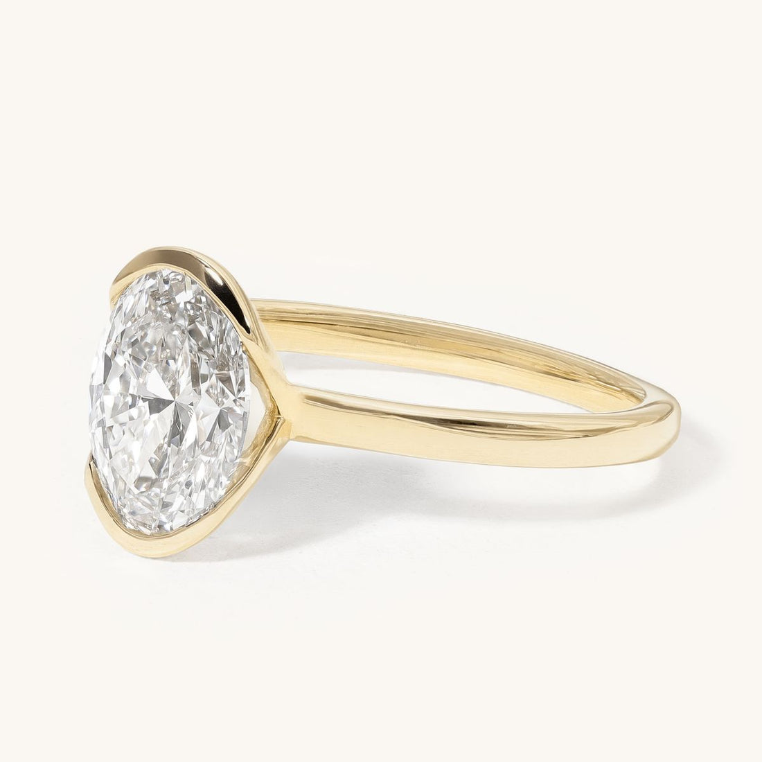 nonnie_oval_half_bezel_solitaire_lab_grown_engagement_ring_01