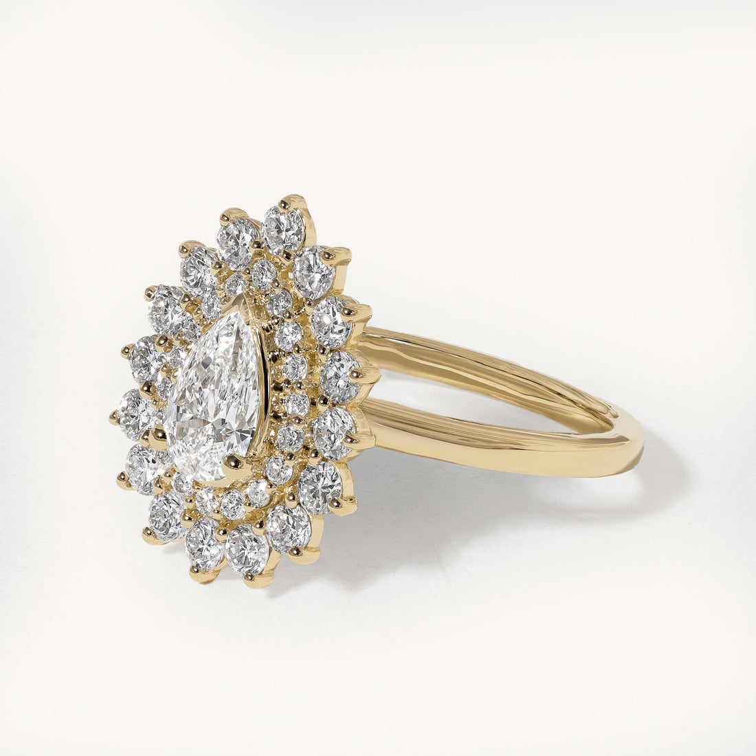 0.58ct Pear Claw Solitaire with Double Halo Engagement Ring